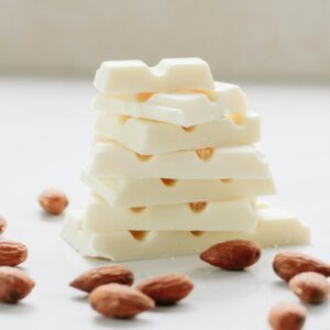 Photo by Elli Delicious white chocolate stacked with almonds for a gourmet treat